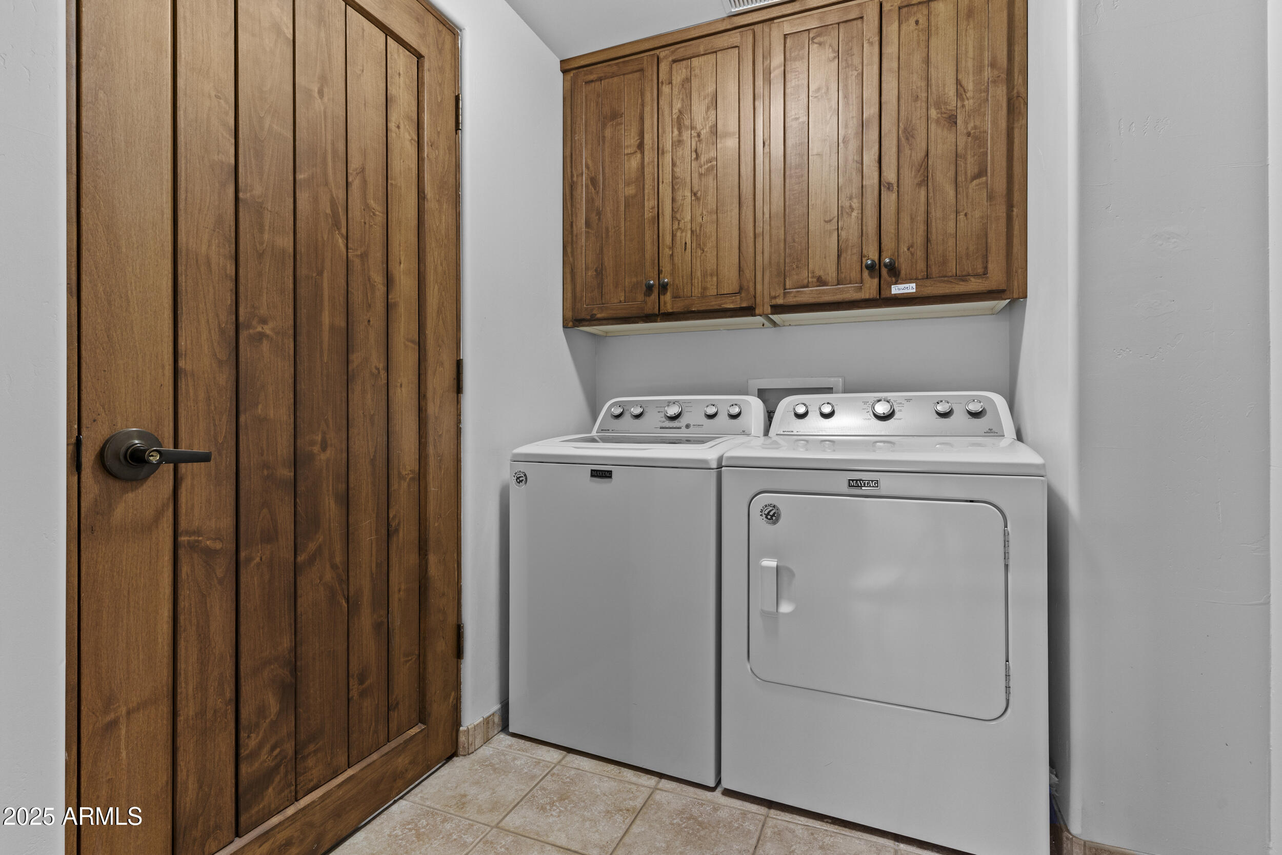 36601 North Mule Train Road, Unit D18 Carefree, AZ 85377 - Photo 37 of 53 a utility room with dryer and washer