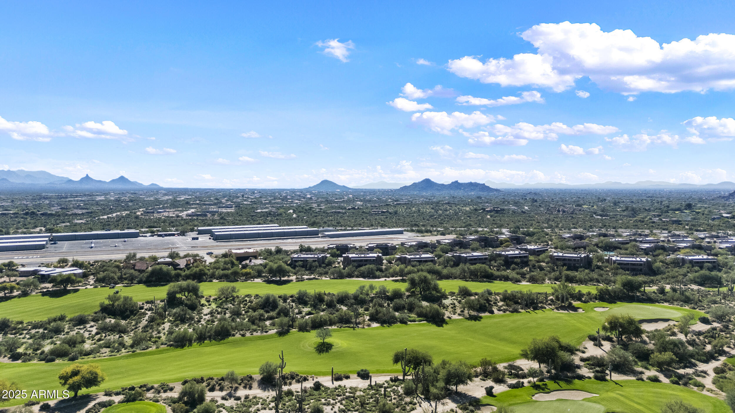 36601 North Mule Train Road, Unit D18 Carefree, AZ 85377 - Photo 41 of 53 a view of a city with mountains in the background