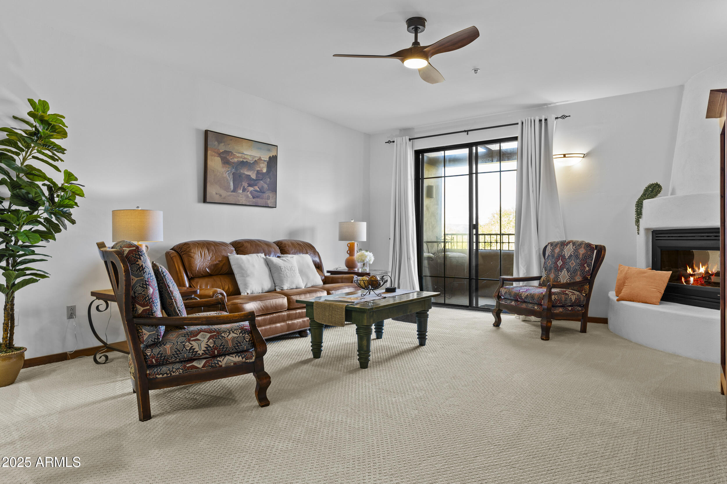 36601 North Mule Train Road, Unit D18 Carefree, AZ 85377 - Photo 10 of 53 a living room with furniture and a window