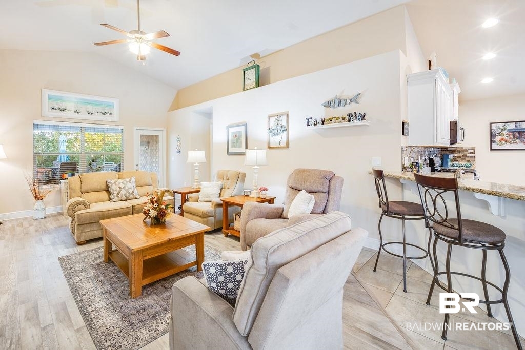 22281 Respite Lane Foley, AL 36535 - Photo 10 of 31 Living room featuring vaulted ceiling, light hardwood / wood-style flooring, and ceiling fan