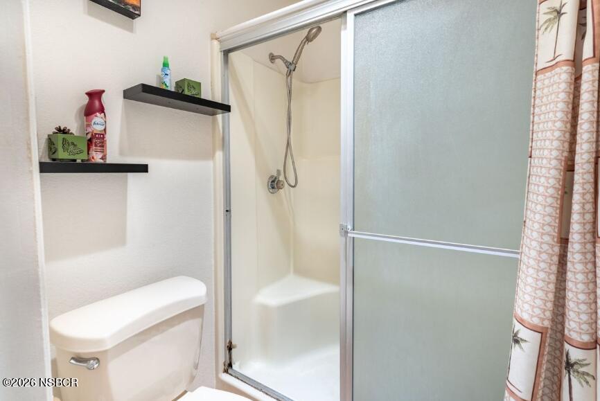 923 North N Place Lompoc, CA 93436 - Photo 13 of 18 a bathroom with a shower and a toilet