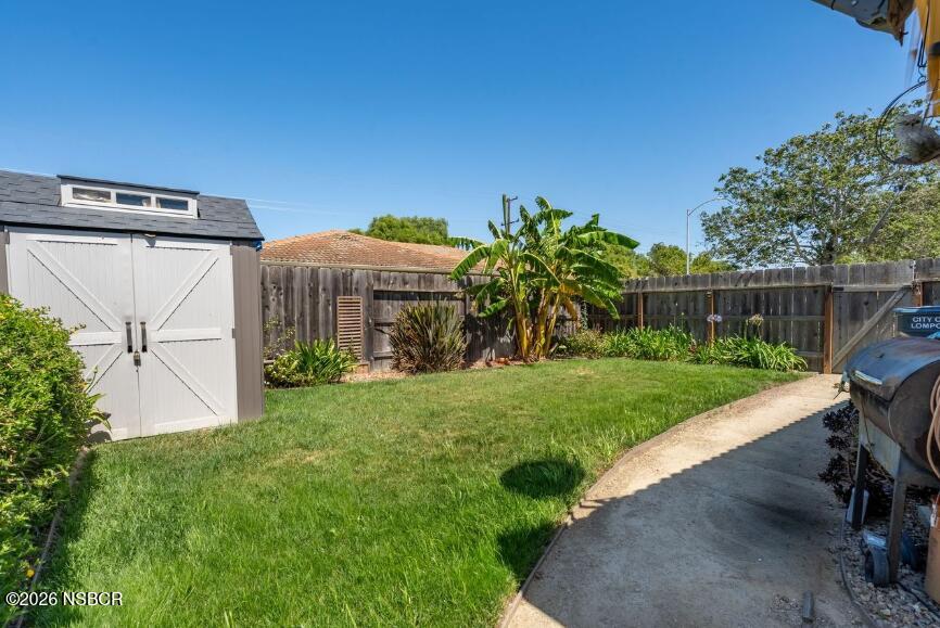 923 North N Place Lompoc, CA 93436 - Photo 17 of 18 a view of a house with backyard and a garden