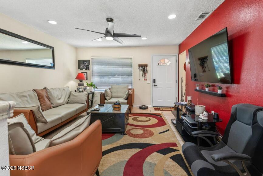 923 North N Place Lompoc, CA 93436 - Photo 4 of 18 a living room with furniture and a flat screen tv