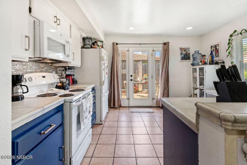 923 North N Place Lompoc, CA 93436 - Photo 8 of 18 a kitchen with stainless steel appliances granite countertop a sink a stove a refrigerator and cabinets