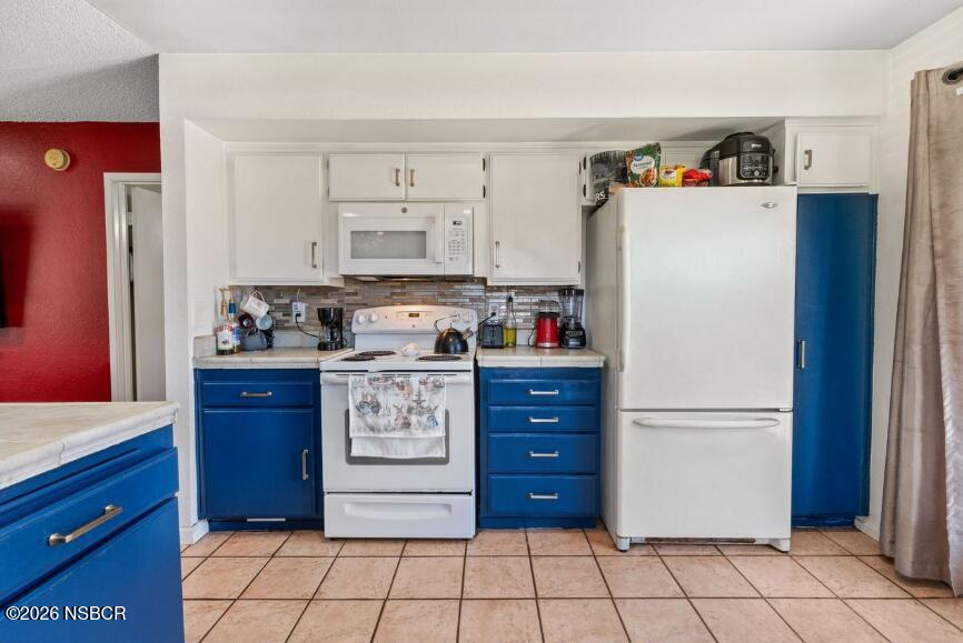 923 North N Place Lompoc, CA 93436 - Photo 9 of 18 a kitchen with stainless steel appliances granite countertop a refrigerator and a stove