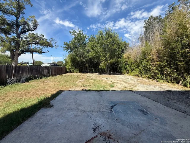 a view of swimming pool with a yard