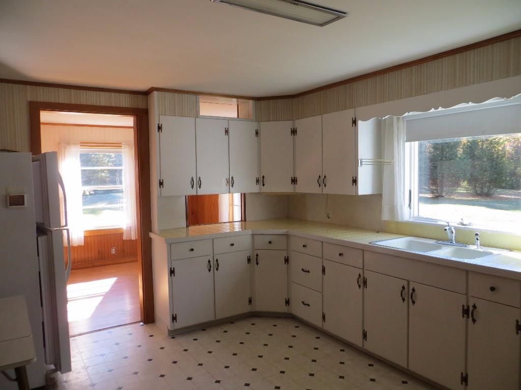 139 Jesse Robbins Road Belfast, ME 04915 - Photo 10 of 25 Kitchen with view of the backyard...