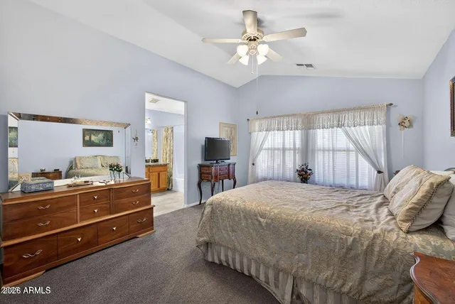 a bedroom with a bed and a dresser