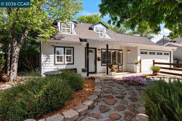 a front view of a house with garden