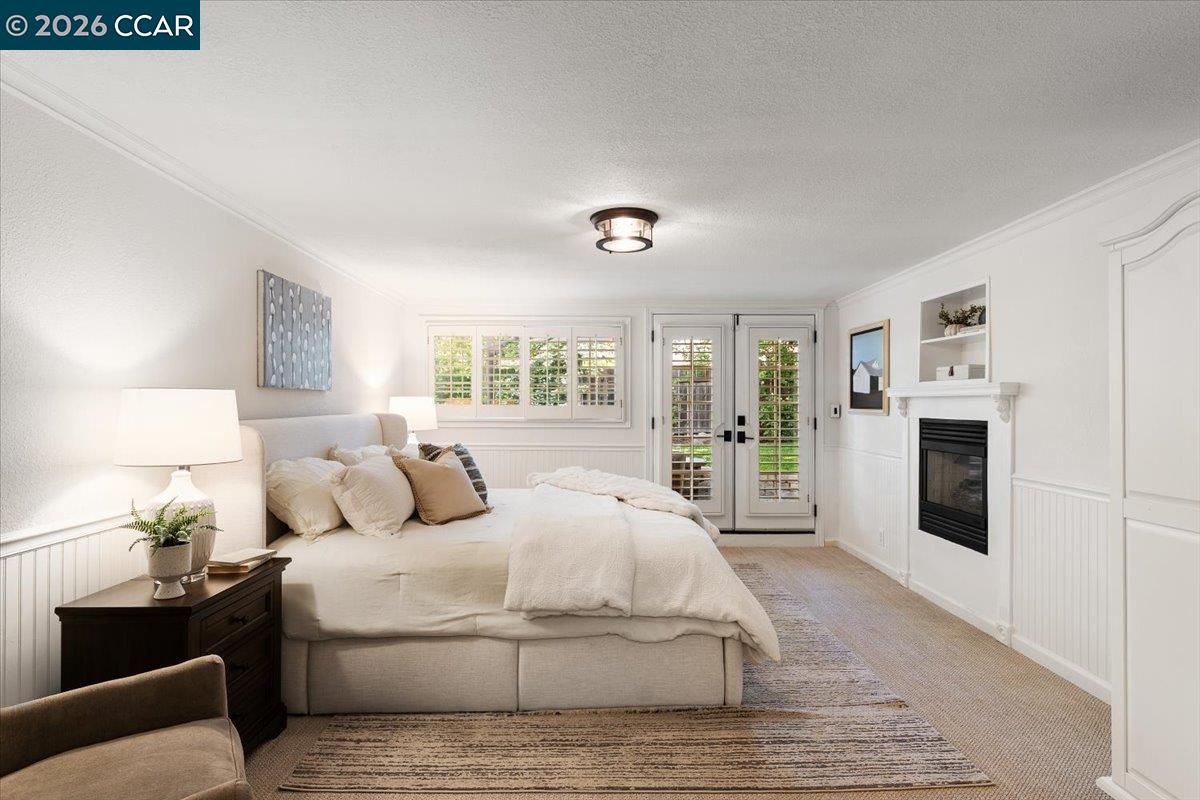 4175 Pickwick Drive Concord, CA 94521 - Photo 11 of 41 a bedroom with a large bed and white walls