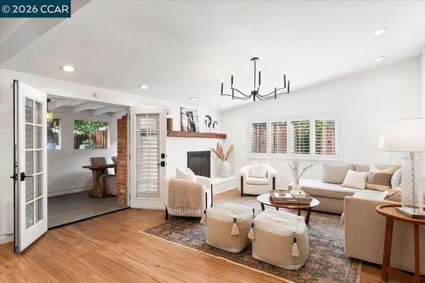 a living room with furniture or couch and a wooden floor