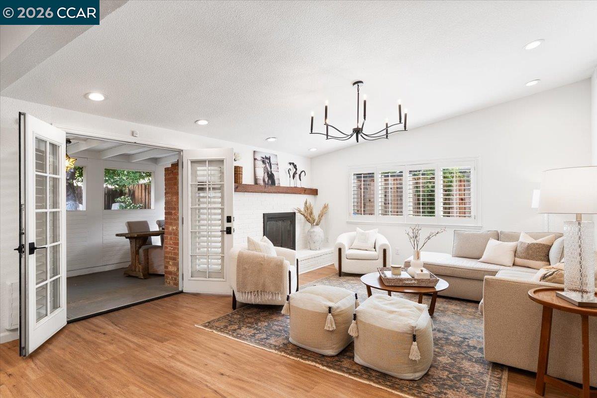 4175 Pickwick Drive Concord, CA 94521 - Photo 2 of 41 a living room with furniture or couch and a wooden floor
