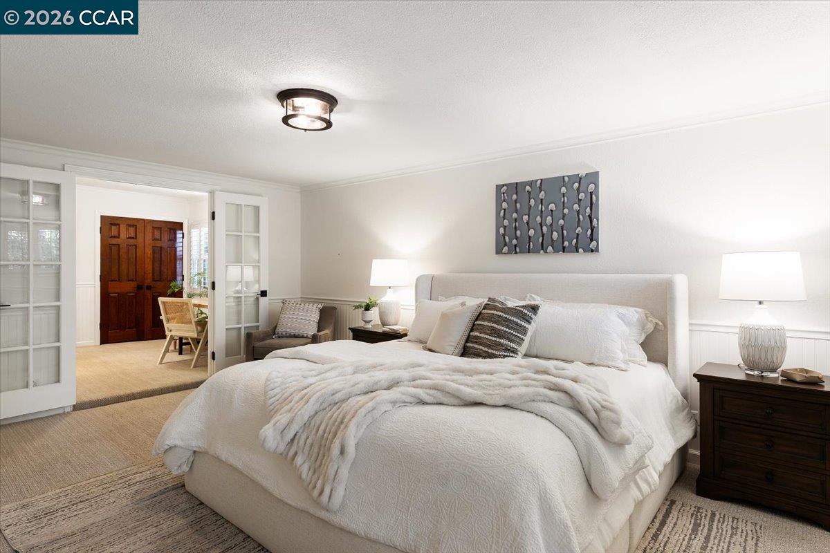 4175 Pickwick Drive Concord, CA 94521 - Photo 26 of 41 a bedroom with a bed and a table