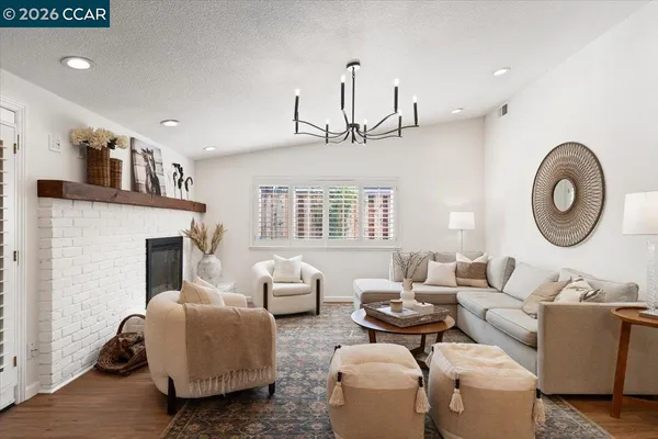 a living room with furniture and a fireplace
