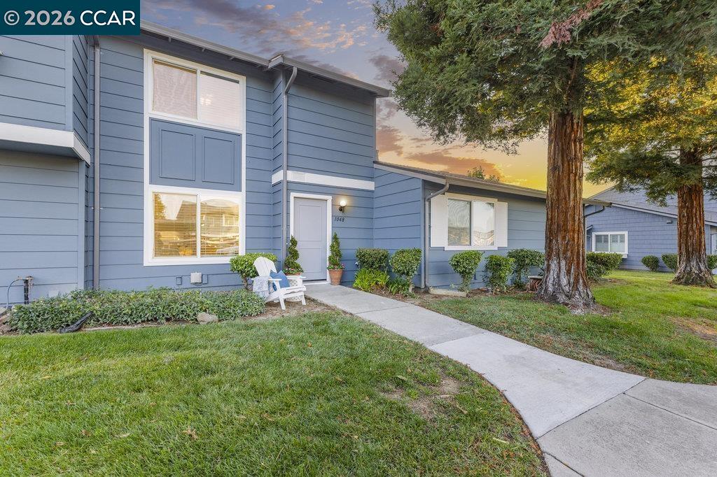 1048 Spring Valley Common Livermore, CA 94551 - Photo 1 of 1 a front view of a house with garden