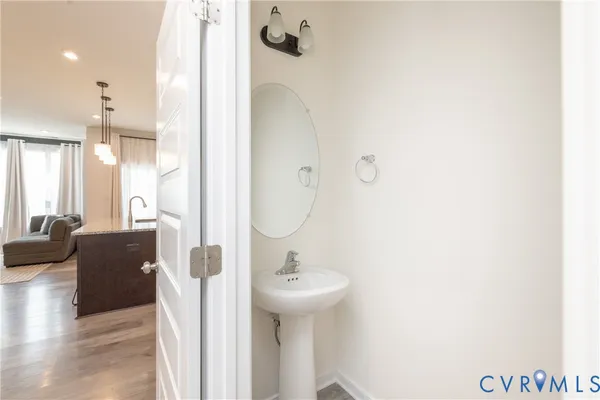 a bathroom with a sink a mirror and shower