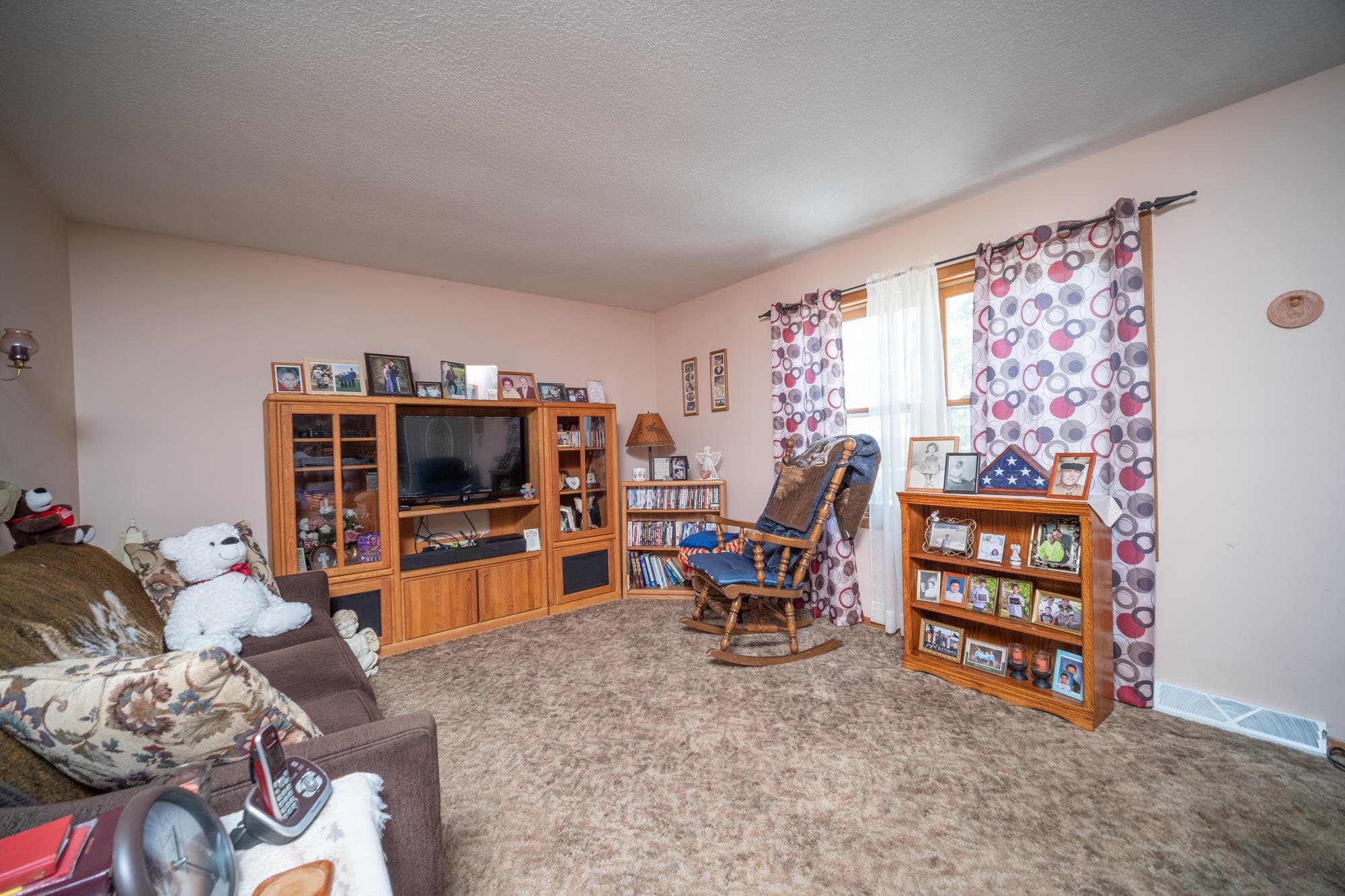 15767 Crowley Road Durand, IL 61024 - Photo 13 of 18 a living room with furniture and a flat screen tv