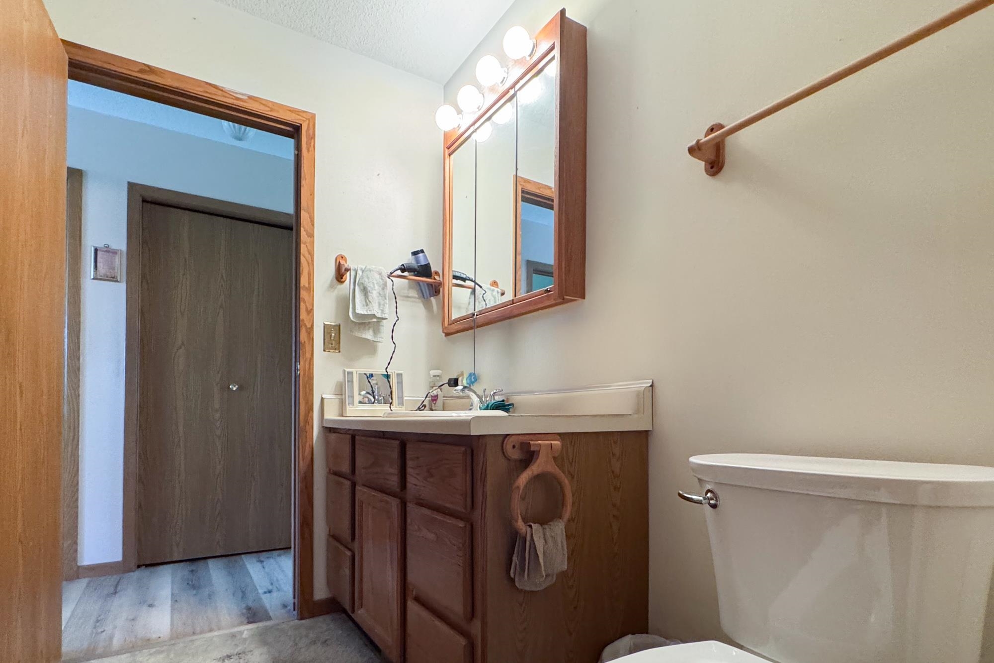 15767 Crowley Road Durand, IL 61024 - Photo 18 of 18 a bathroom with a toilet sink and mirror