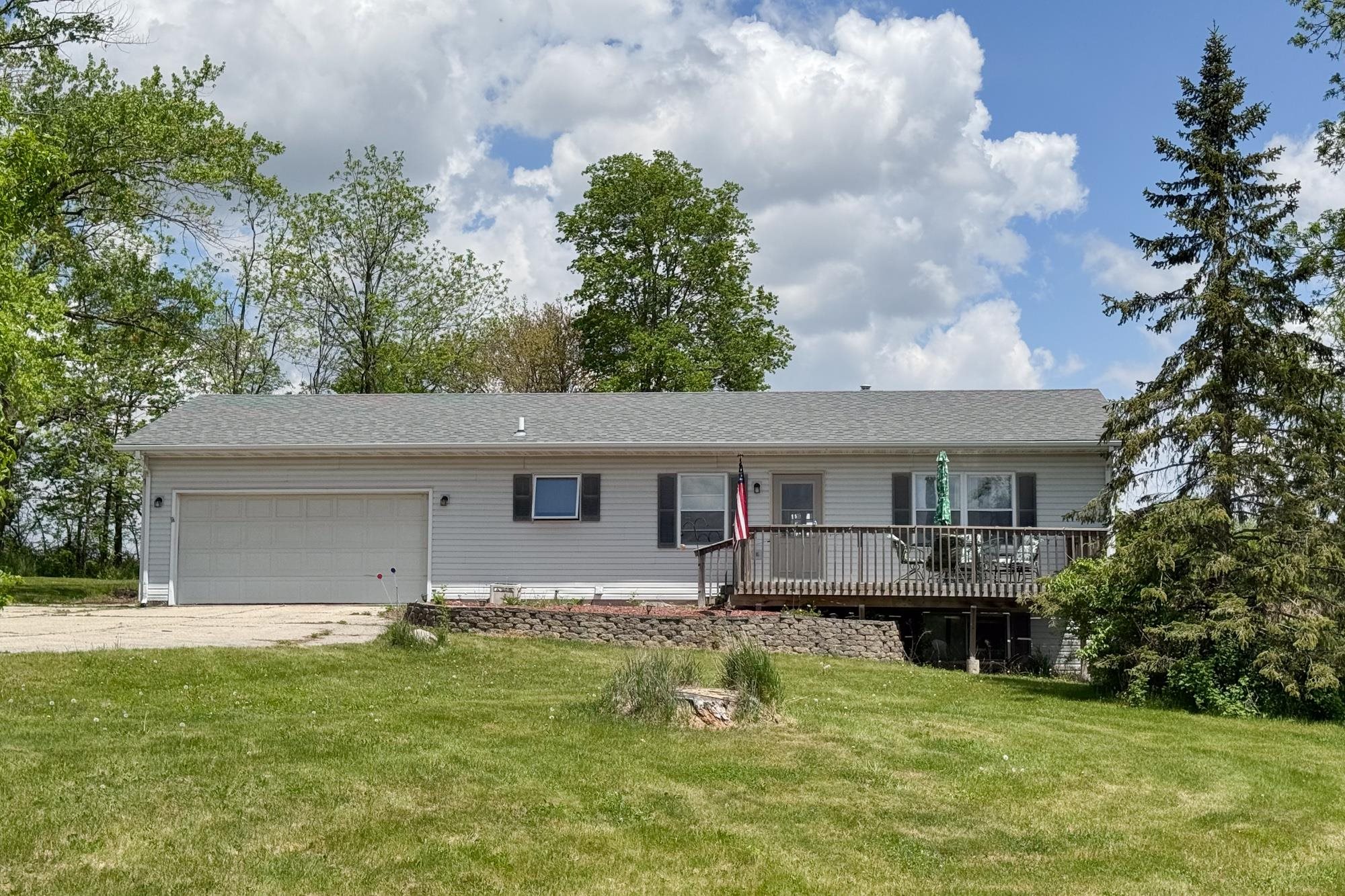 15767 Crowley Road Durand, IL 61024 - Photo 2 of 18 a backyard of a house with yard and trampoline