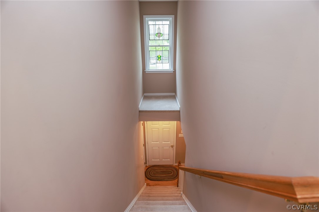 4544 Peters Creek Road Columbia, VA 23038 - Photo 43 of 50 View of the stairwell from the second level.
