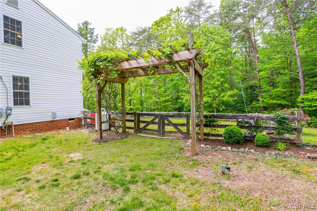 4544 Peters Creek Road Columbia, VA 23038 - Photo 47 of 50 Large pergola with grape vines that leads to the f