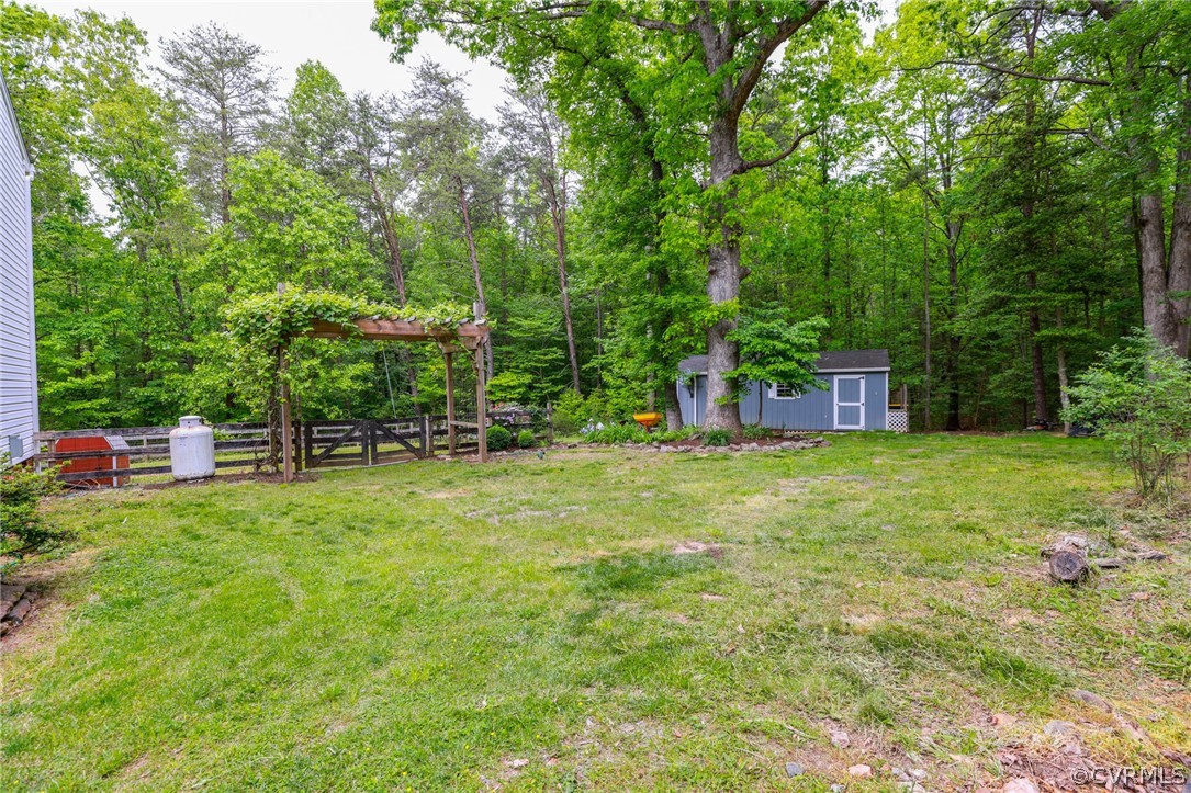 4544 Peters Creek Road Columbia, VA 23038 - Photo 49 of 50 Side yard with a beautiful pergola with grape vine