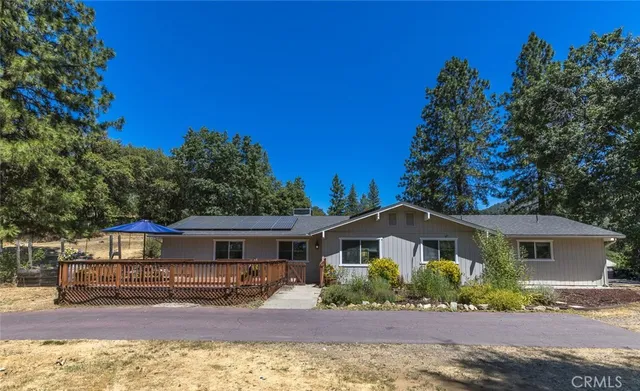 a balcony with wooden floor and stairs
