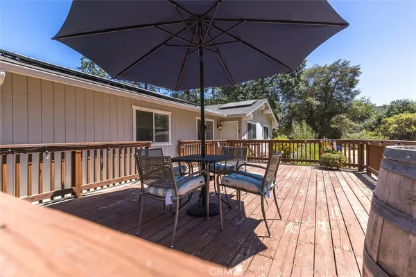 a view of balcony with deck and patio