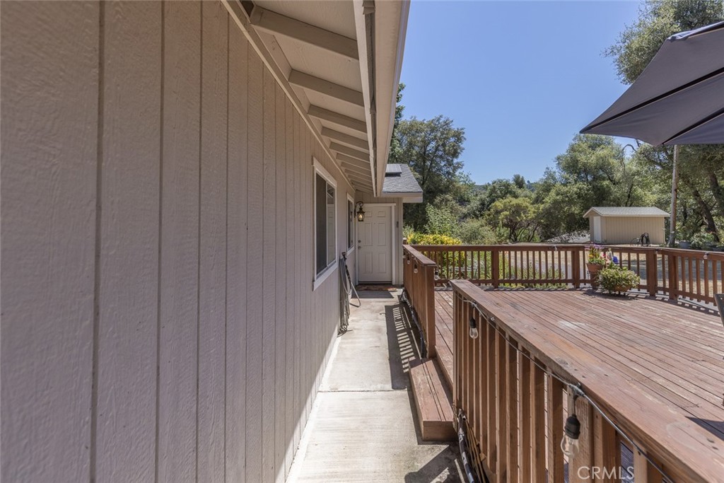 45315 Forest Ridge Drive Ahwahnee, CA 93601 - Photo 36 of 75 a balcony with wooden floor and stairs