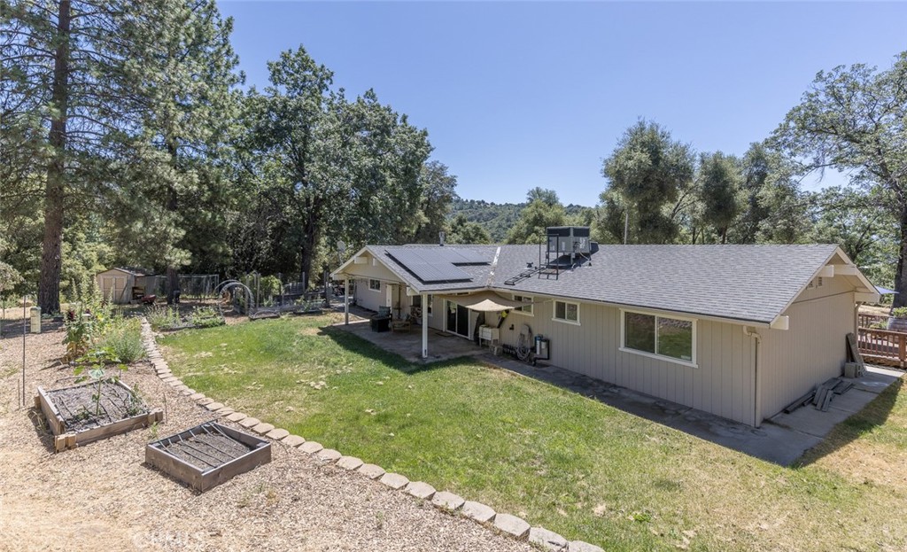 45315 Forest Ridge Drive Ahwahnee, CA 93601 - Photo 53 of 75 a aerial view of a house with swimming pool and a yard