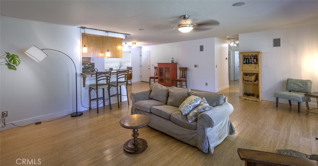 45315 Forest Ridge Drive Ahwahnee, CA 93601 - Photo 7 of 75 a living room with furniture and wooden floor