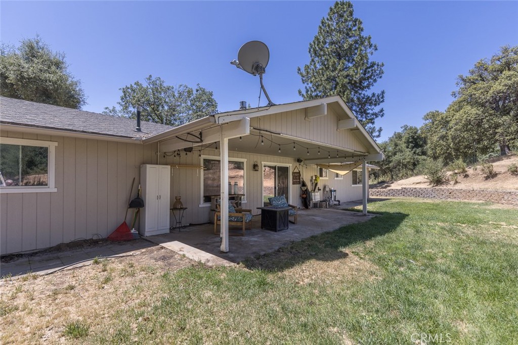 45315 Forest Ridge Drive Ahwahnee, CA 93601 - Photo 72 of 75 a front view of a house with garden