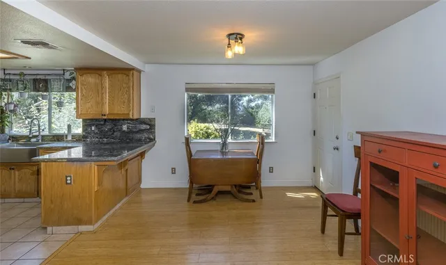 a kitchen with stainless steel appliances granite countertop a sink and cabinets