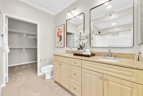 a bedroom with a bed and a view of bathroom