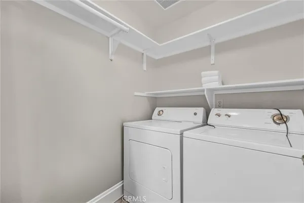 a bathroom with a sink toilet vanity and shower