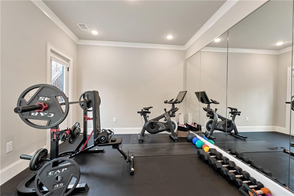 6140 Crescent Moon Ridge Cumming, GA 30041 - Photo 36 of 54 a view of a room with gym equipment