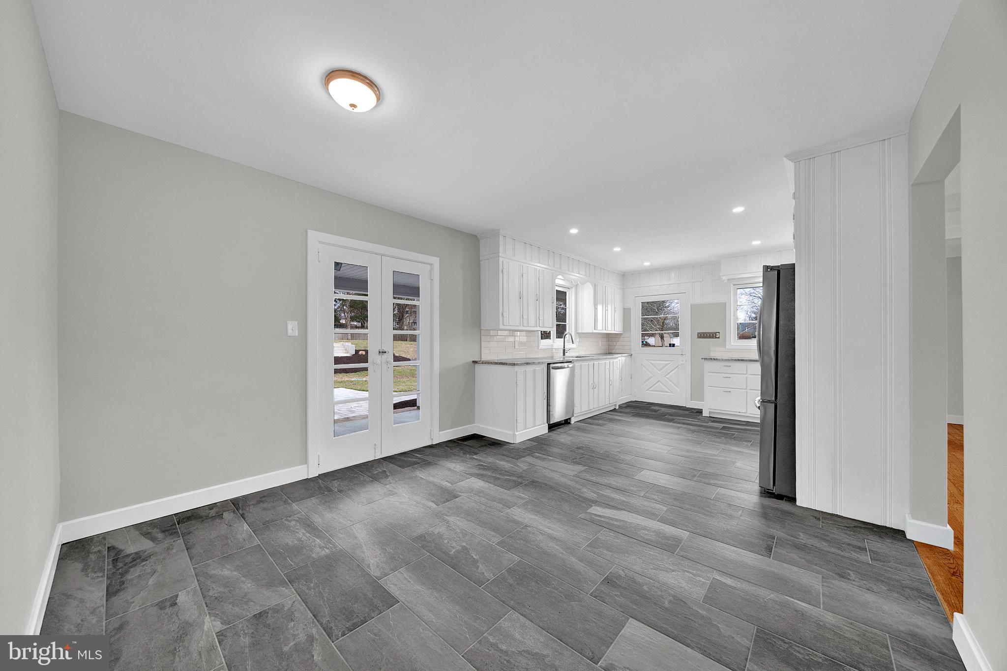 412 Washington Crossing Pennington Road Titusville, NJ 08560 - Photo 11 of 38 a view of a kitchen with wooden floor and windows
