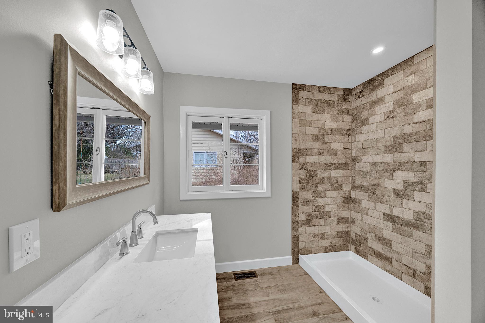412 Washington Crossing Pennington Road Titusville, NJ 08560 - Photo 22 of 38 a bathroom with a sink a toilet and shower