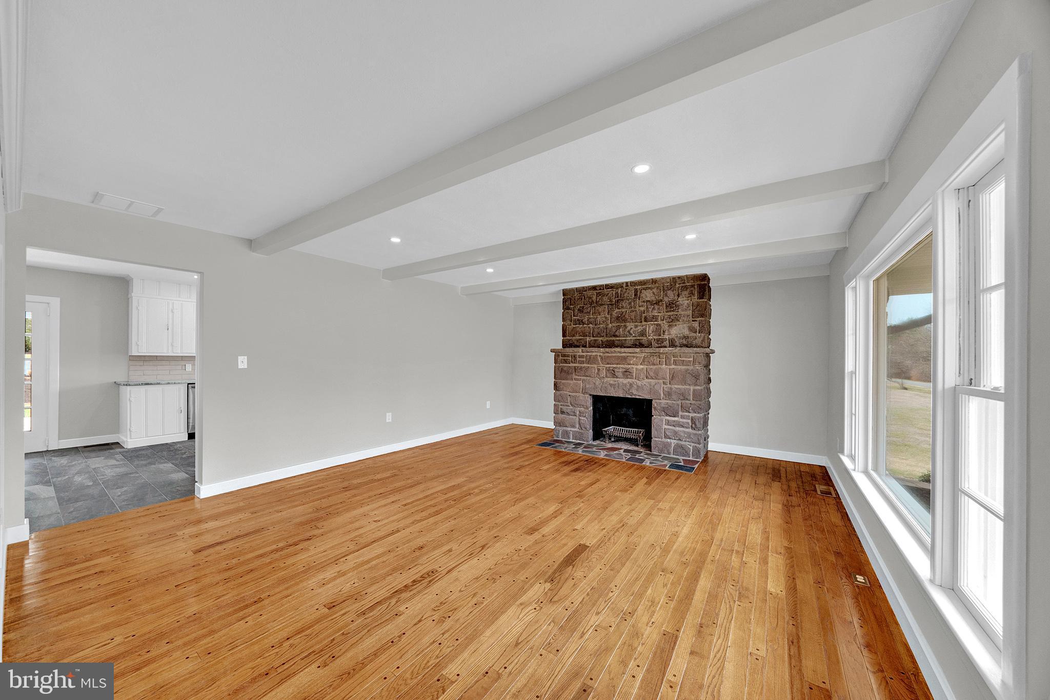 412 Washington Crossing Pennington Road Titusville, NJ 08560 - Photo 5 of 38 a view of an empty room with a fireplace and a window