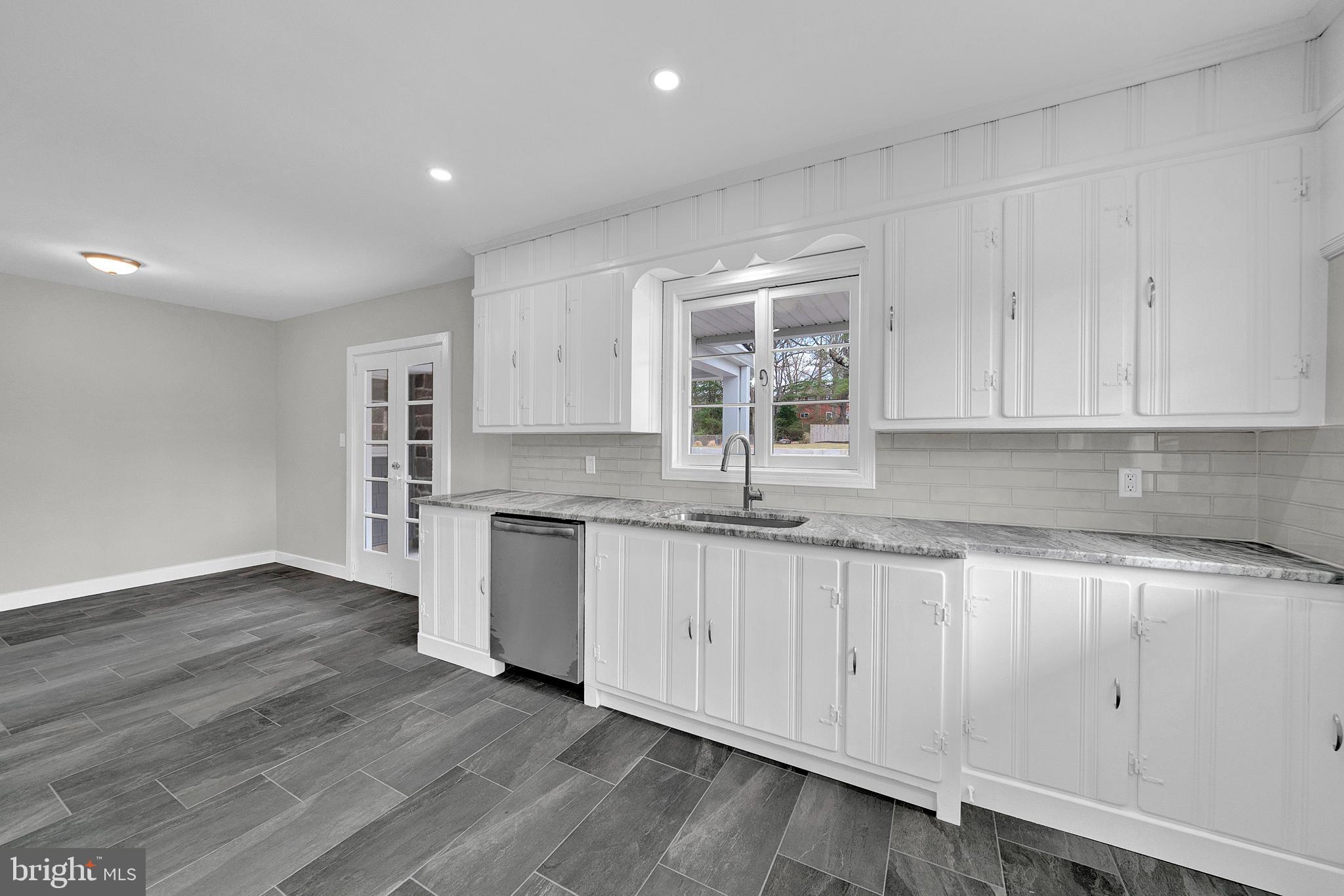 412 Washington Crossing Pennington Road Titusville, NJ 08560 - Photo 10 of 38 a kitchen with granite countertop white cabinets and a sink