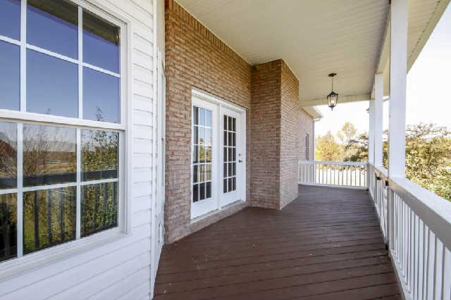 296 Ernest Cates Road Bethpage, TN 37022 - Photo 16 of 20 Spend countless hours on this covered porch surrounded by lots of land
