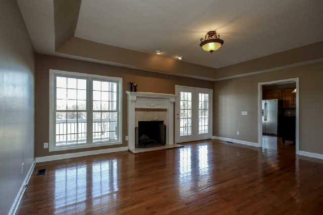 296 Ernest Cates Road Bethpage, TN 37022 - Photo 4 of 20 Cozy Livingroom w/ fireplace w/ beautiful hardwood flooring!