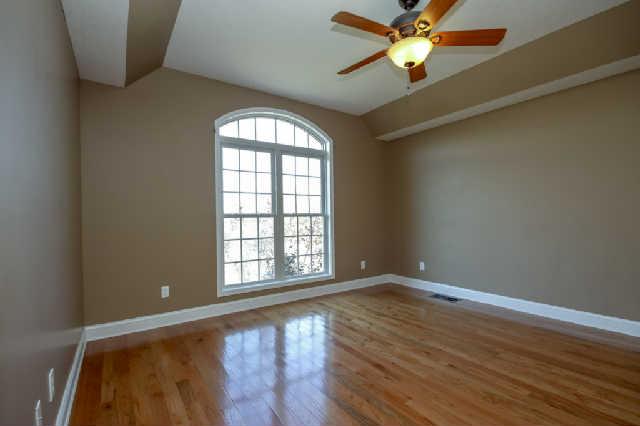 296 Ernest Cates Road Bethpage, TN 37022 - Photo 8 of 20 Spacious master bedroom on main level offers amazing light and cozy comforts.