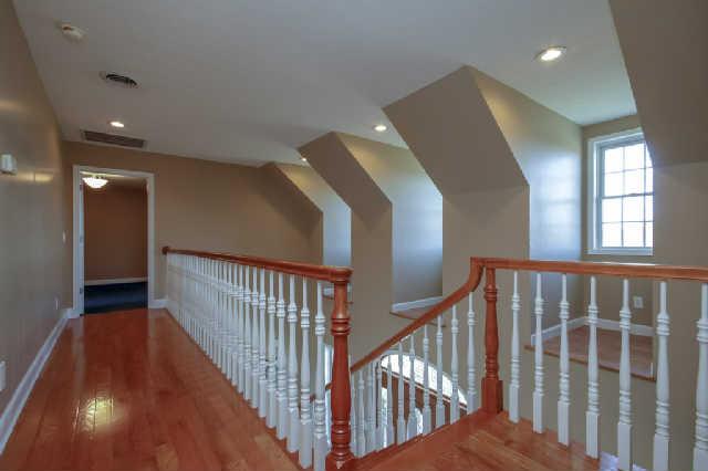 296 Ernest Cates Road Bethpage, TN 37022 - Photo 10 of 20 Hallway w/ recess lighting & hardwood flooring lead to upstairs bedrooms