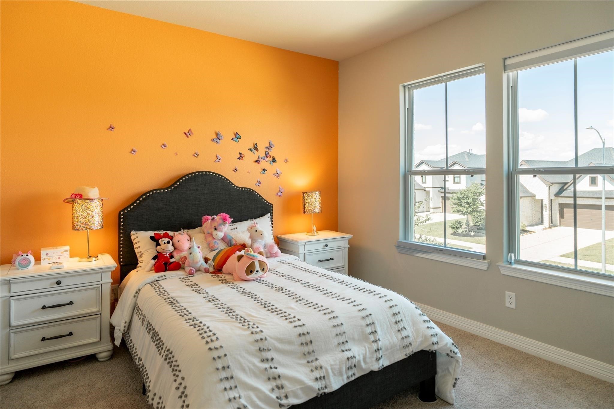 29023 Laurel Grove Lane Fulshear, TX 77441 - Photo 21 of 42 a bedroom with a bed and window