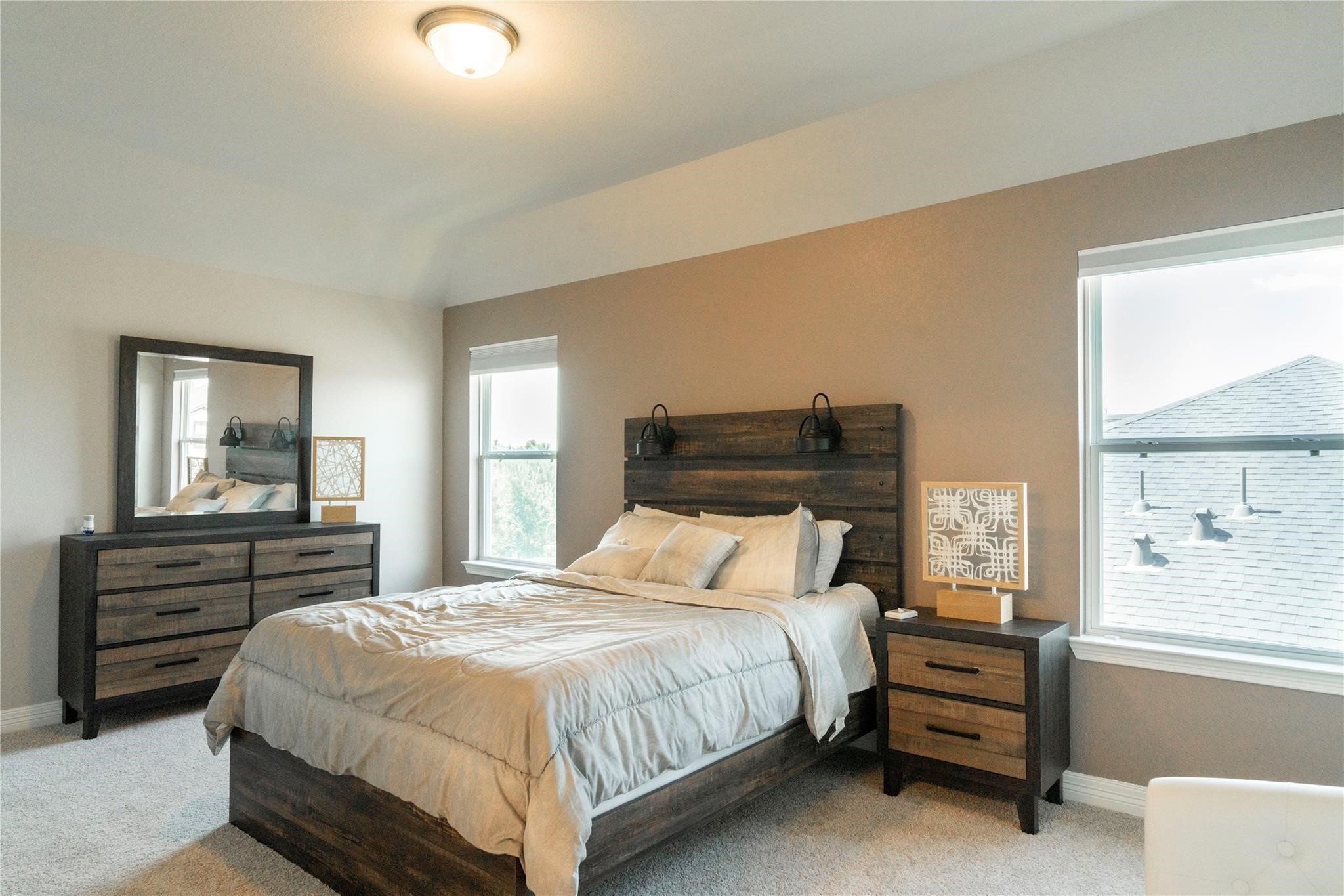 29023 Laurel Grove Lane Fulshear, TX 77441 - Photo 28 of 42 a bedroom with a bed and wooden floor