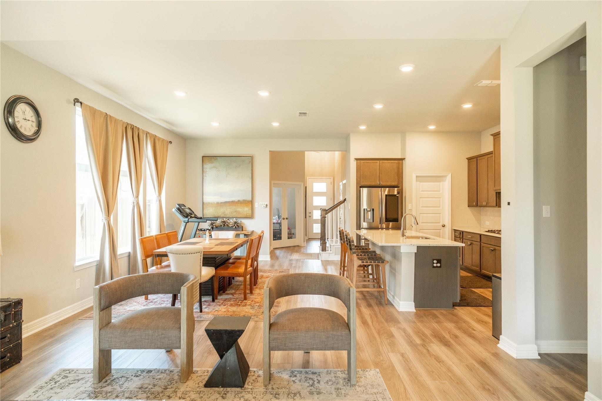 29023 Laurel Grove Lane Fulshear, TX 77441 - Photo 6 of 42 a living room with stainless steel appliances furniture cabinets and a wooden floor