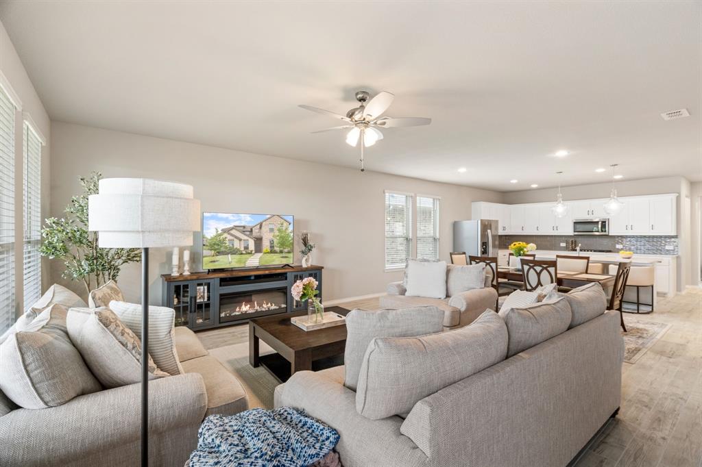 321 Pasture Drive Midlothian, TX 76065 - Photo 8 of 40 a living room with furniture kitchen view and a chandelier