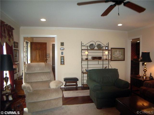 13106 Bluemont Road Chester, VA 23831 - Photo 6 of 12 a living room with furniture and a flat screen tv