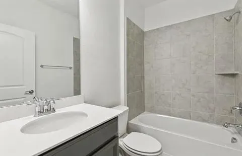 a bathroom with a sink toilet and bathtub